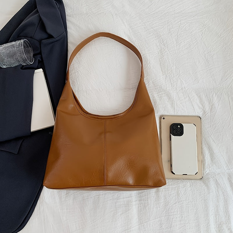 Um conjunto elegante e versátil de duas peças para mulheres, com uma bolsa de ombro macia e confortável e uma mala, perfeito para saídas casuais.