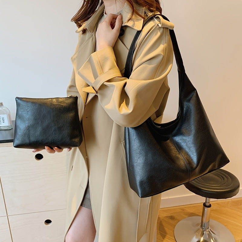 Um conjunto elegante e versátil de duas peças para mulheres, com uma bolsa de ombro macia e confortável e uma mala, perfeito para saídas casuais.