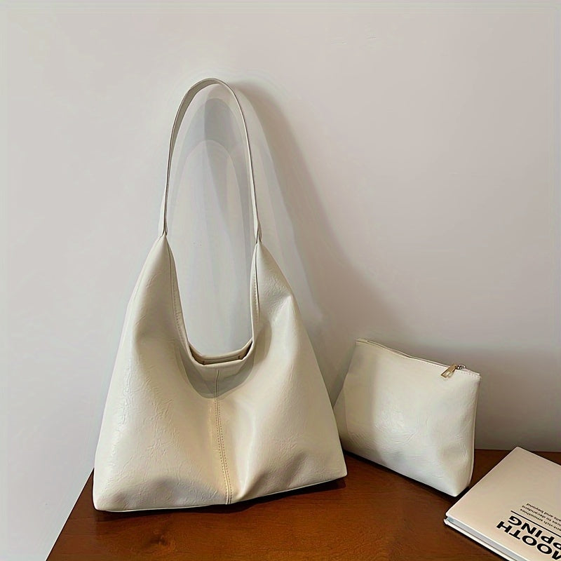 Um conjunto elegante e versátil de duas peças para mulheres, com uma bolsa de ombro macia e confortável e uma mala, perfeito para saídas casuais.