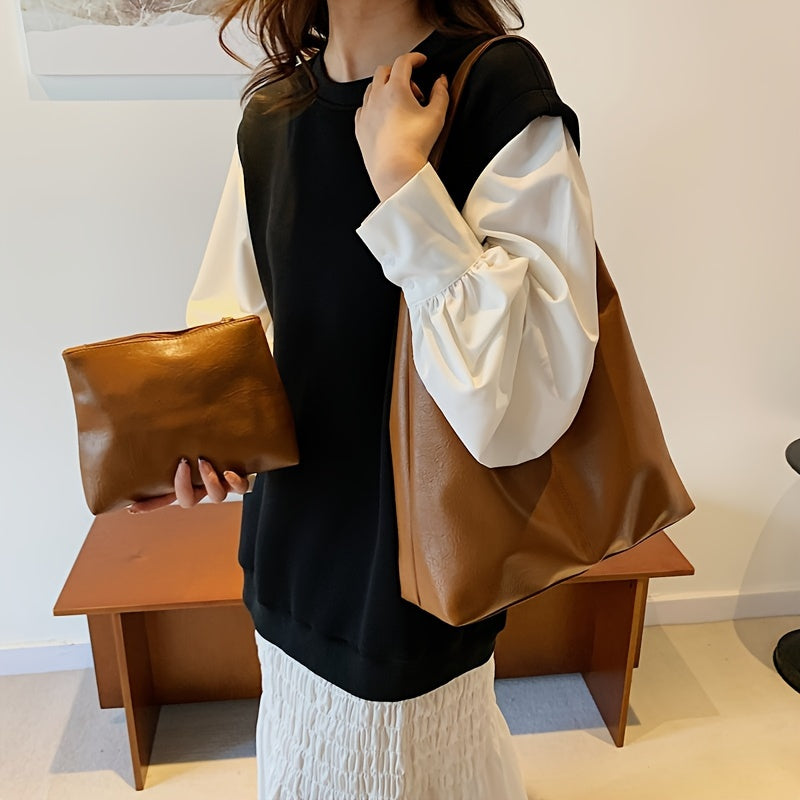Um conjunto elegante e versátil de duas peças para mulheres, com uma bolsa de ombro macia e confortável e uma mala, perfeito para saídas casuais.