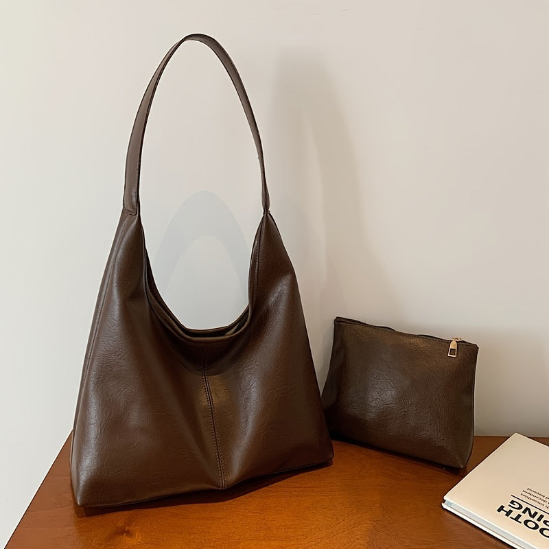 Um conjunto elegante e versátil de duas peças para mulheres, com uma bolsa de ombro macia e confortável e uma mala, perfeito para saídas casuais.