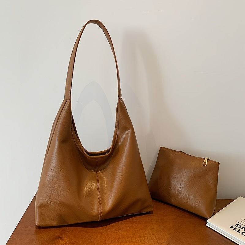 Um conjunto elegante e versátil de duas peças para mulheres, com uma bolsa de ombro macia e confortável e uma mala, perfeito para saídas casuais.